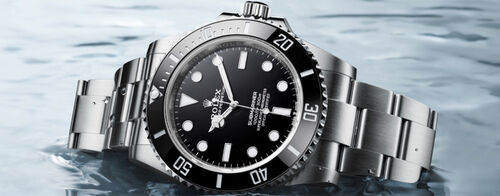 A Rolex Submariner with black dial